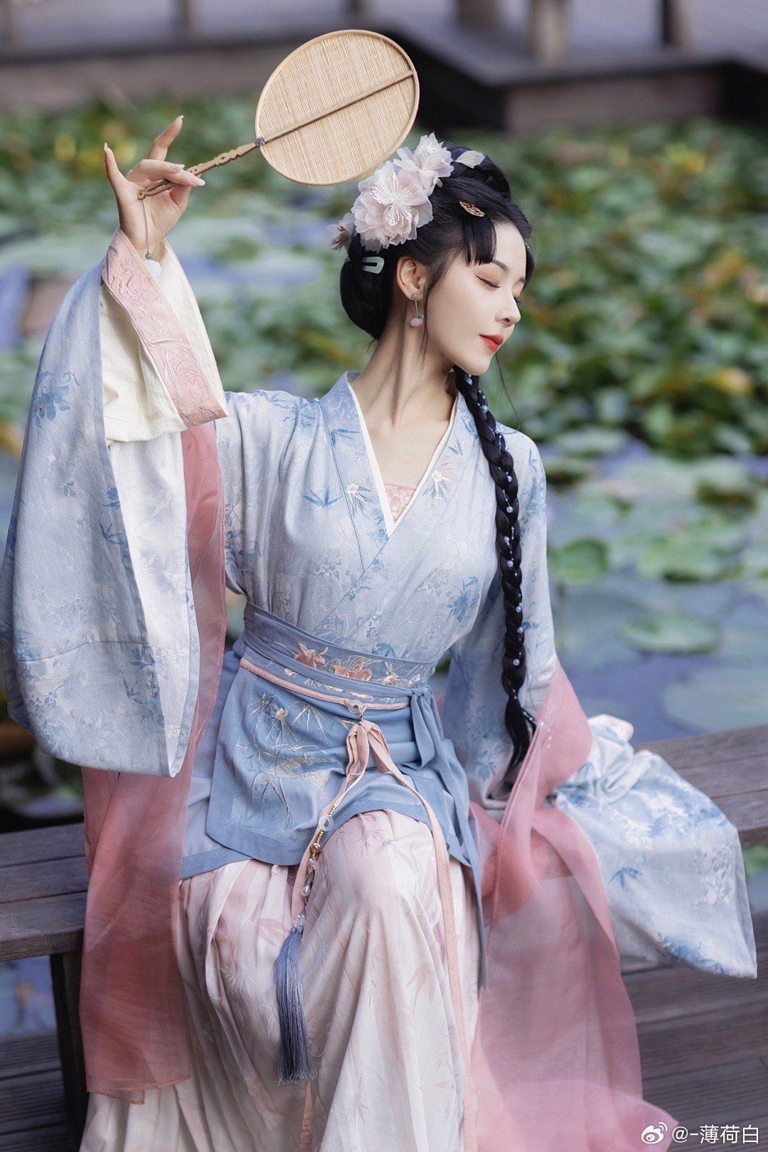 A Girl Child in Hanfu Performing Guzheng on Stage A Girl Child in Hanfu Performing Guzheng on Stage