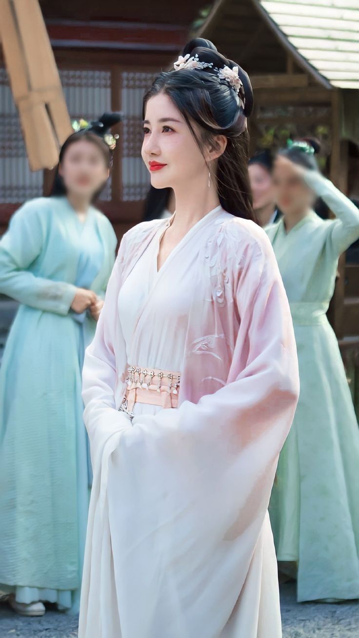 The Enchantment of Traditional Chinese Cheongsam in a Blush Pink Hue