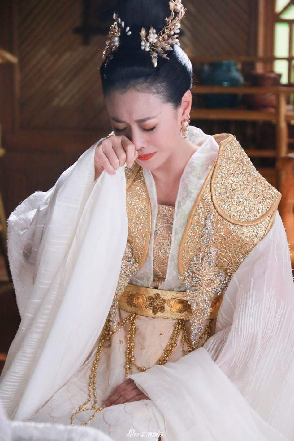 The Elegance of a Mid-Age Lady in a Cheongsam Dress The Elegance of a Mid-Age Lady in a Cheongsam Dress